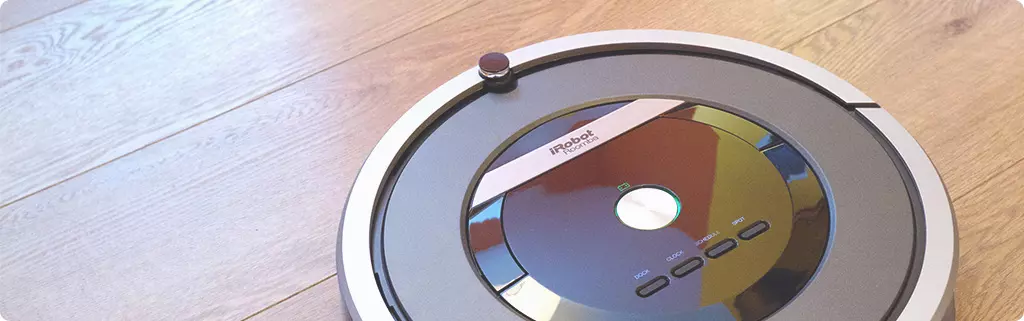 How do I replace the battery in my Roomba vacuum cleaner?