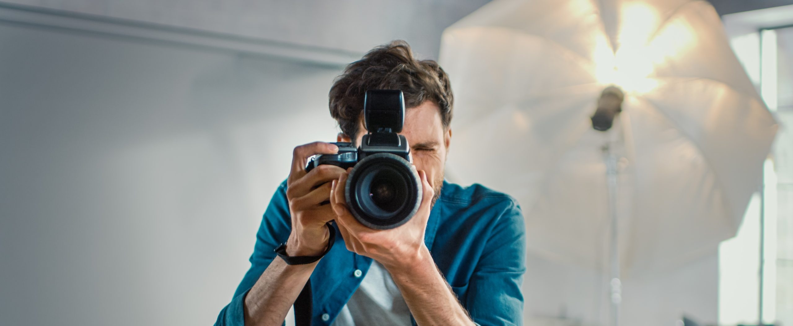 man with camera in the photo studio