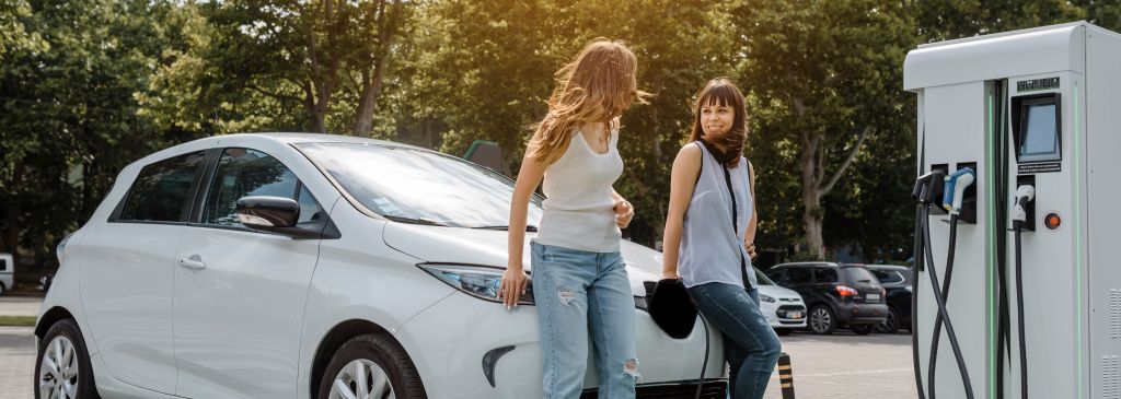 electric car and two women