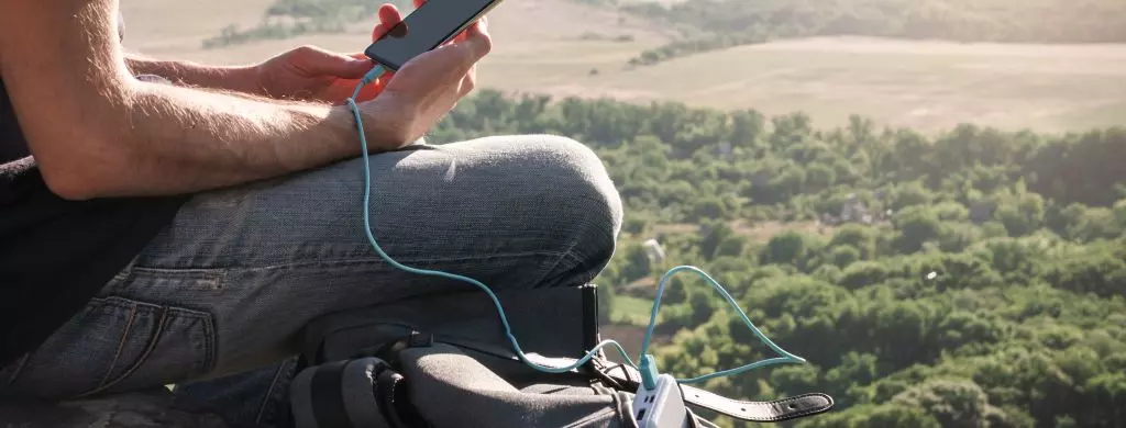 man with powerbank on a hike